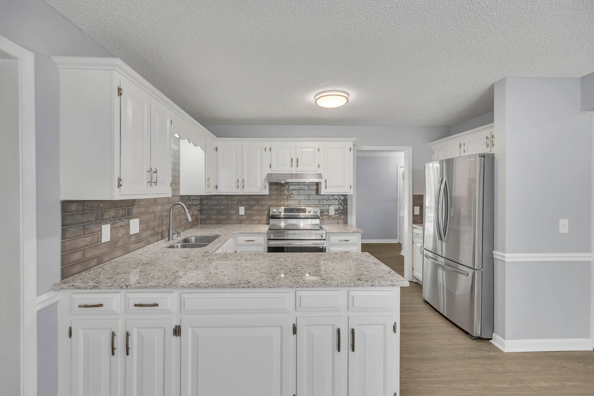 3544 Shakertown Road Antioch, TN 37013 - Photo 1 of 57 a kitchen with granite countertop a refrigerator and a sink