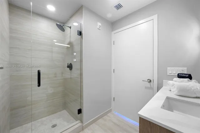 a bathroom with a sink and a shower