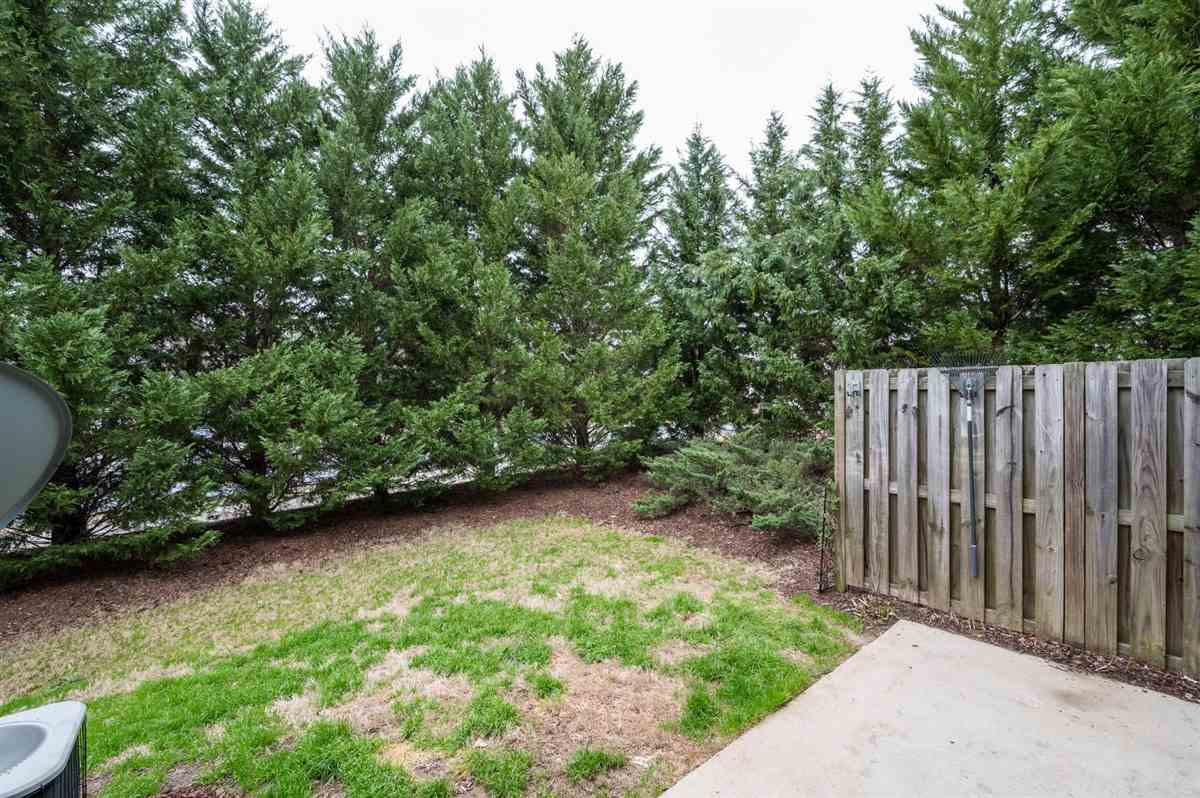 8311 Clasara Circle Raleigh, NC 27613 - Photo 26 of 27 Private, tree-lined back patio with room to relax or grill out. Storage closet for extra storage space! Patio