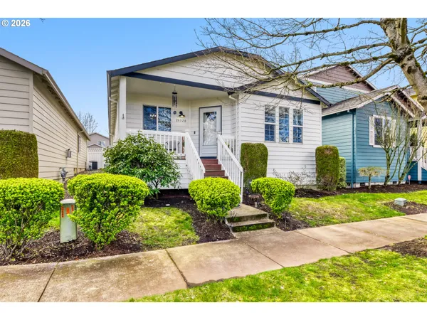 a front view of a house with garden