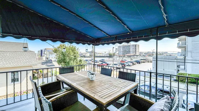 a view of a chairs and table on the deck