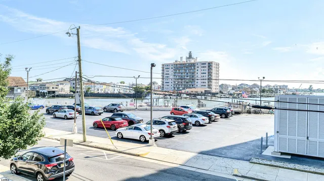 a car driving down a road next to a road