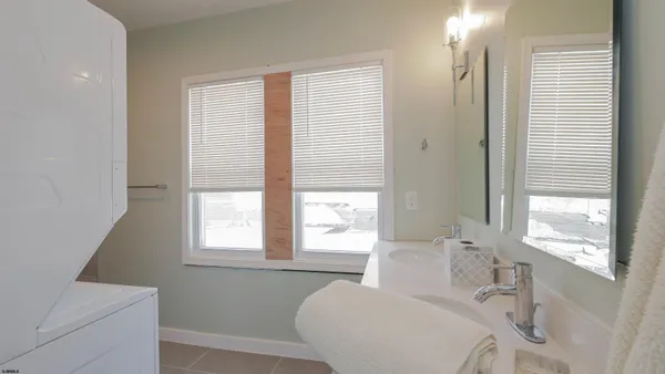a view of bathroom with a shower and sink
