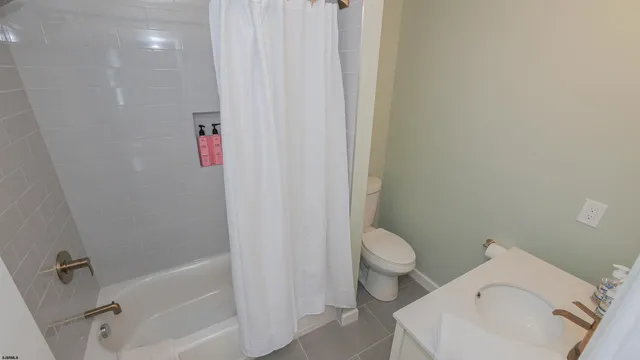 a bathroom with a sink and toilet