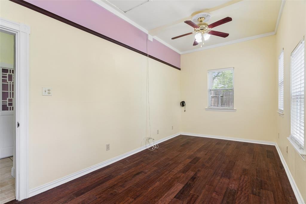 5824 Boone Street Sachse, TX 75048 - Photo 24 of 40 a view of a big room with wooden floor and a window