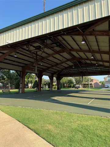a view of a water fountain and a big yard