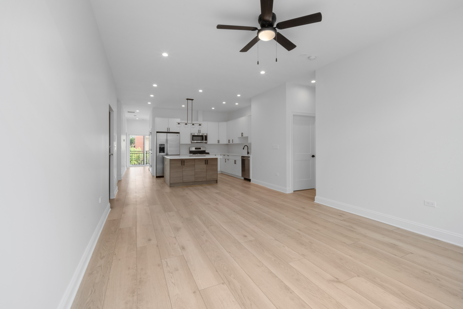 70 East Pershing Road, Unit 4W Chicago, IL 60653 - Photo 6 of 9 a view of a kitchen with a sink and a refrigerator