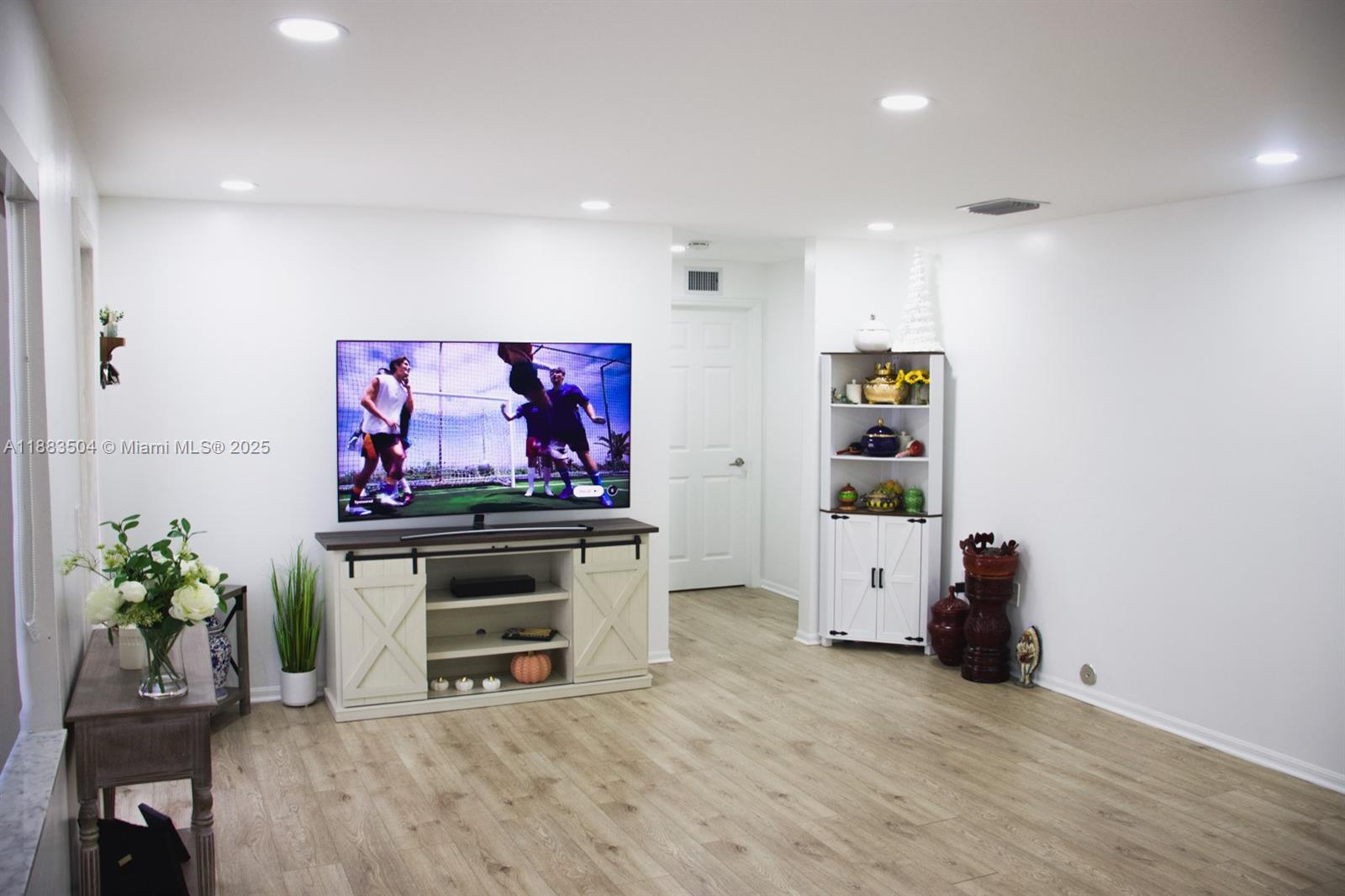 25760 Southwest 127th Court Homestead, FL 33032 - Photo 12 of 25 a living room with furniture and a flat screen tv