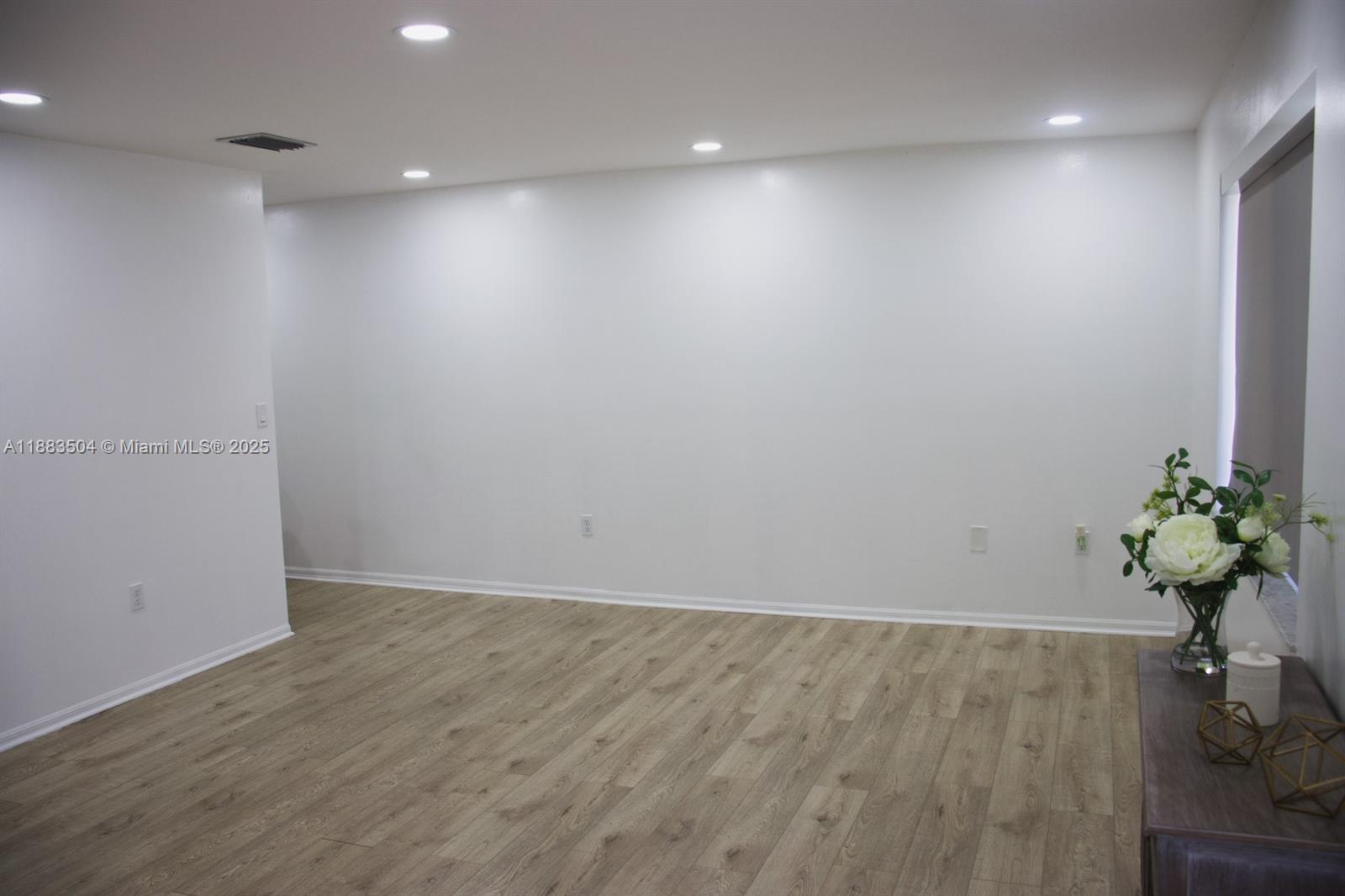 25760 Southwest 127th Court Homestead, FL 33032 - Photo 13 of 25 a view of a room with wooden floor