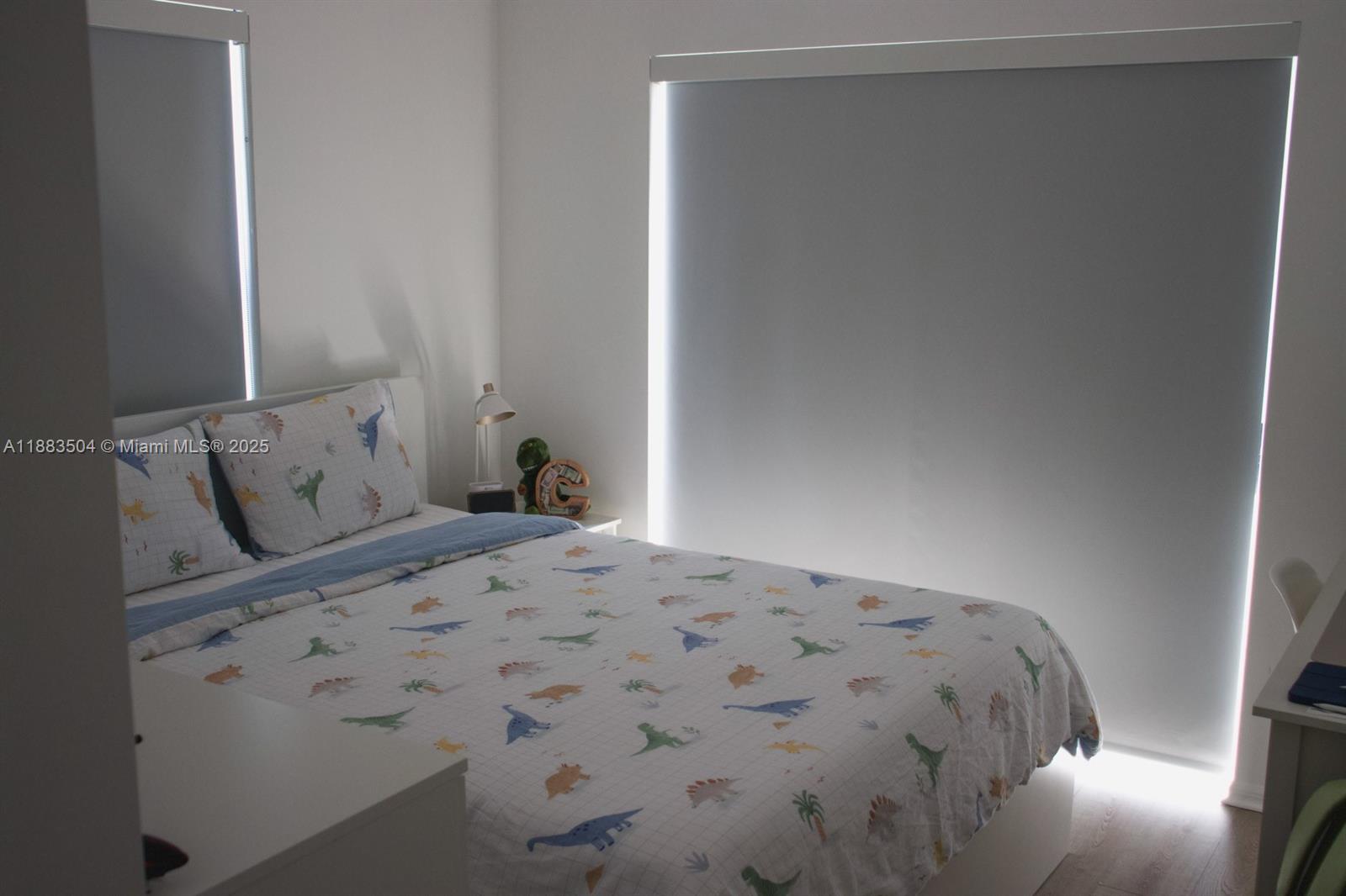 25760 Southwest 127th Court Homestead, FL 33032 - Photo 14 of 25 a bedroom with a bed and a window