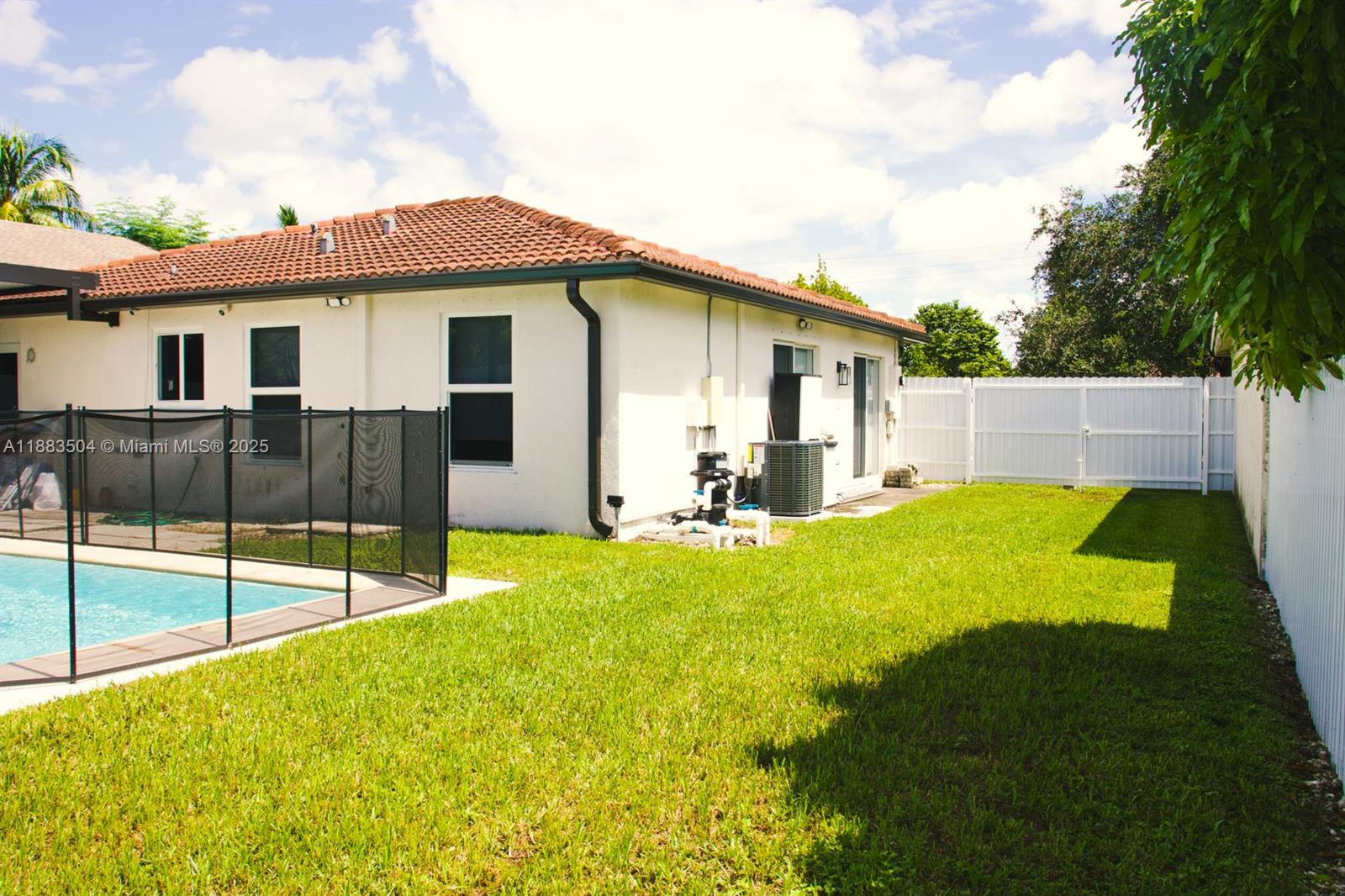 25760 Southwest 127th Court Homestead, FL 33032 - Photo 17 of 25 a view of a backyard with a garden and plants