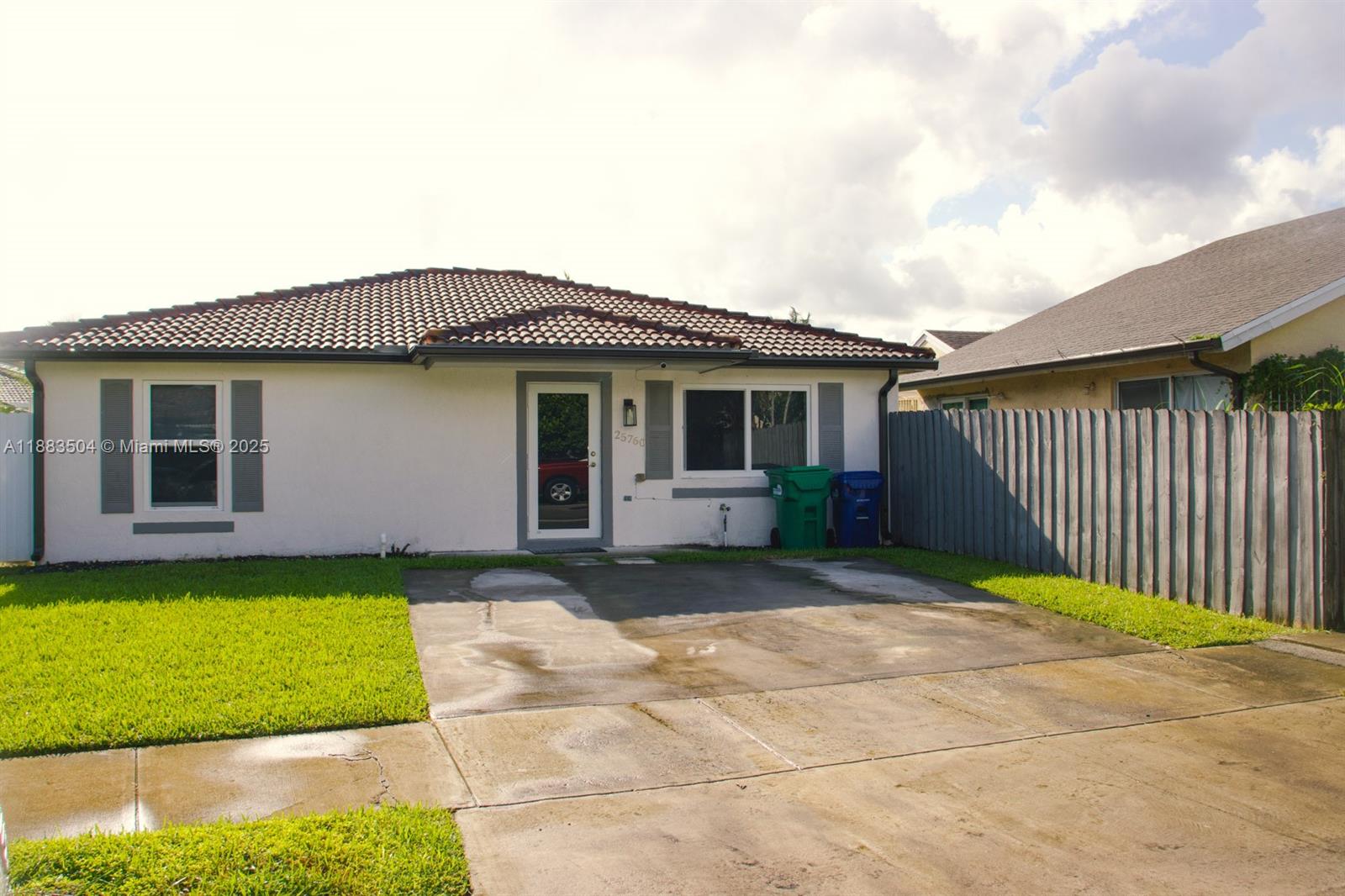 25760 Southwest 127th Court Homestead, FL 33032 - Photo 23 of 25 a house view with a garden space