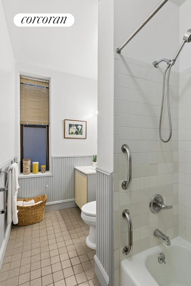 400 3rd Street, Unit 2L Brooklyn, NY 11215 - Photo 11 of 13 a bathroom with a sink a toilet and shower