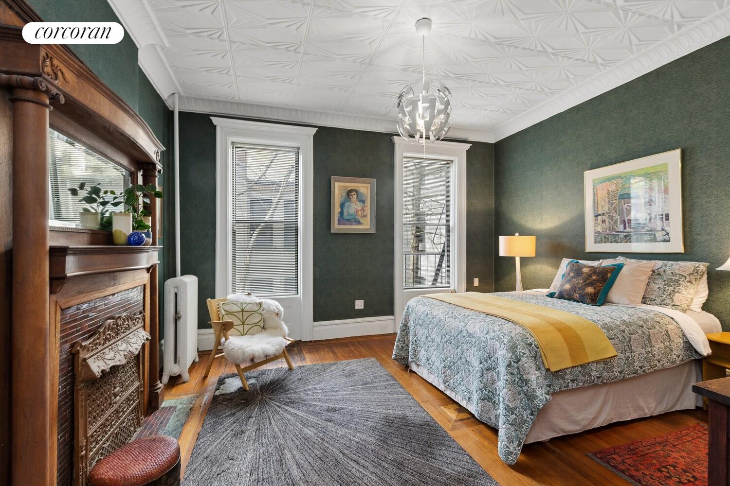 400 3rd Street, Unit 2L Brooklyn, NY 11215 - Photo 7 of 13 a bedroom with a large bed chandelier and a window