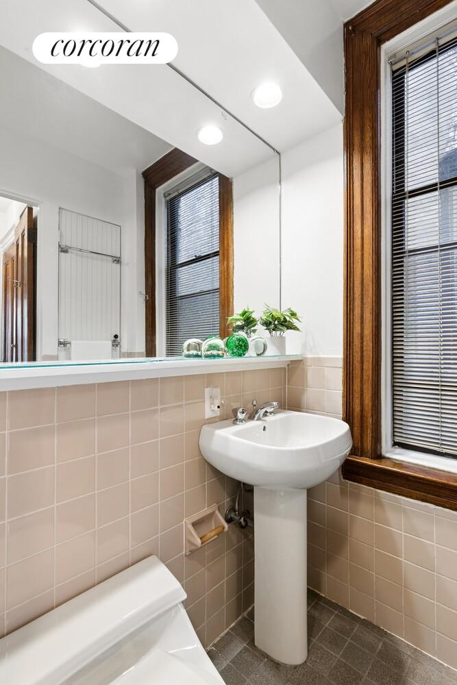 400 3rd Street, Unit 2L Brooklyn, NY 11215 - Photo 8 of 13 a bathroom with a sink and a mirror