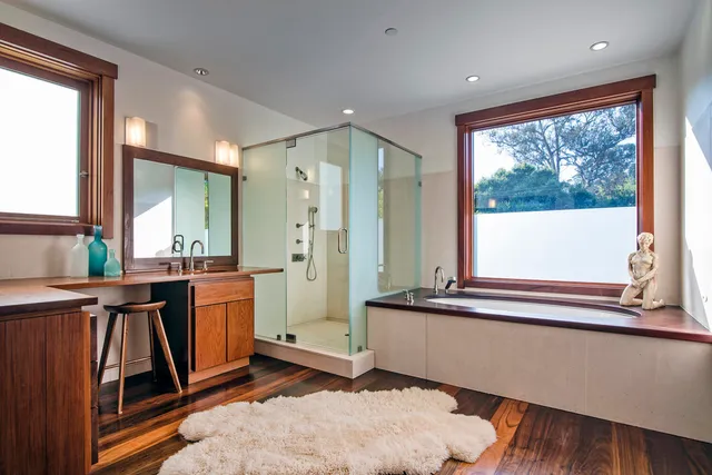 a view of a living room and a balcony