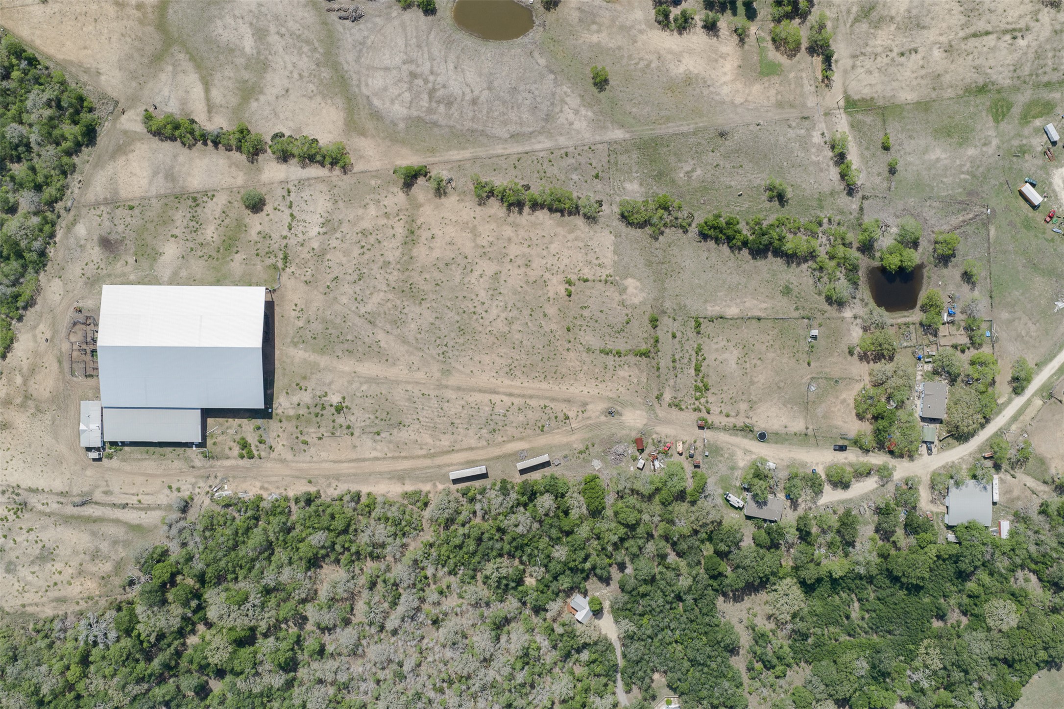 8519 State Park Road Lockhart, TX 78644 - Photo 16 of 40 Aerial view of property and surrounding area featuring rural landscape