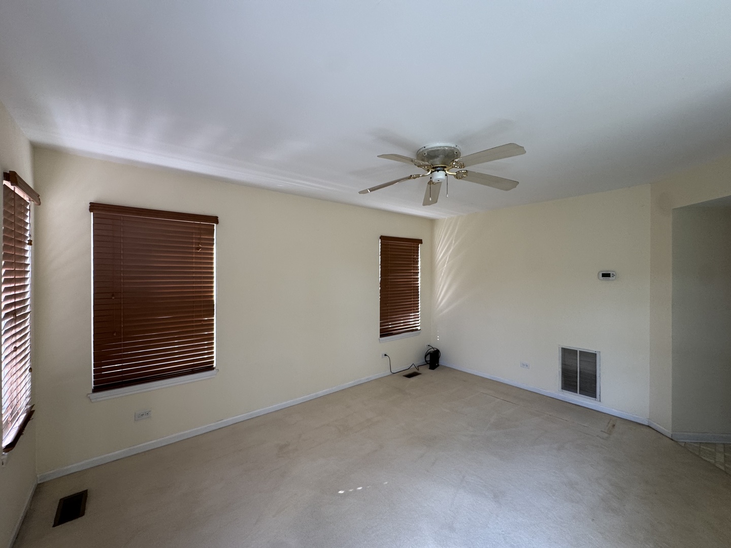 1124 Blackburn Drive Grayslake, IL 60030 - Photo 11 of 19 a view of an empty room with a ceiling fan