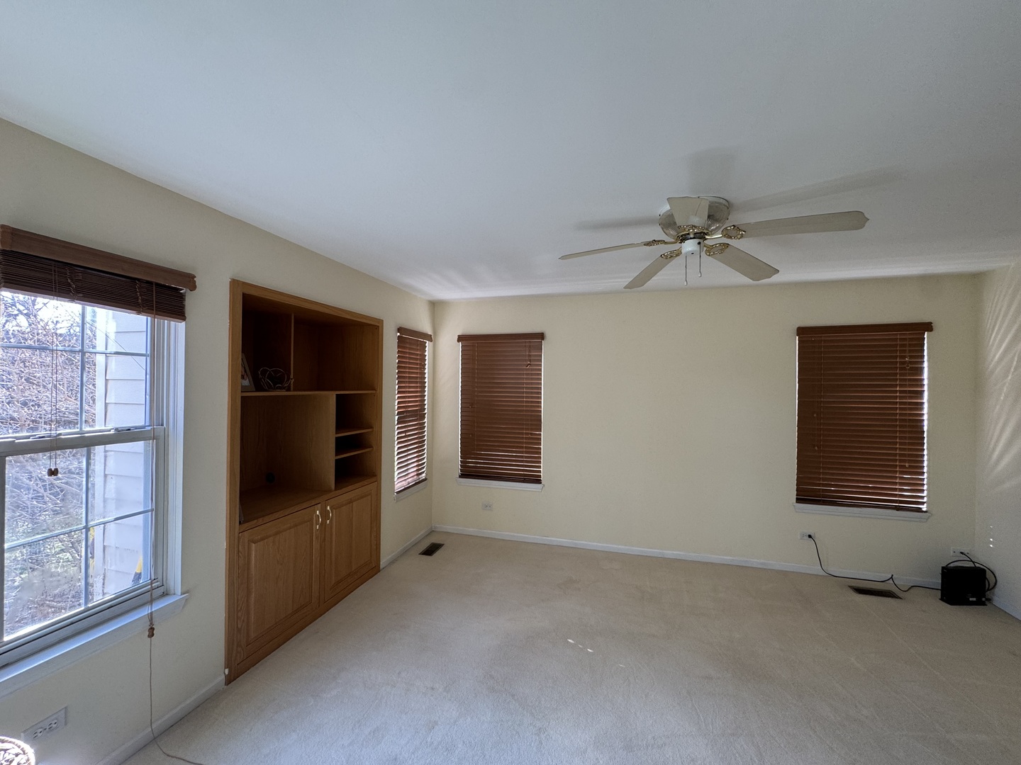 1124 Blackburn Drive Grayslake, IL 60030 - Photo 14 of 19 a view of an empty room with a window and a kitchen