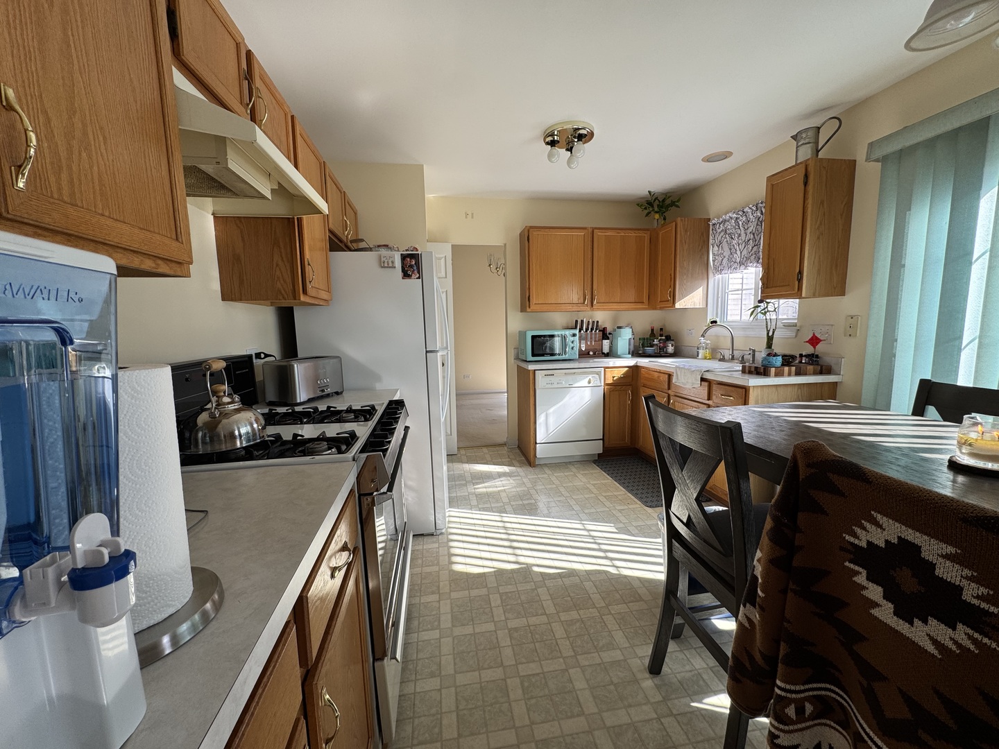 1124 Blackburn Drive Grayslake, IL 60030 - Photo 16 of 19 a kitchen with stainless steel appliances granite countertop a sink stove and refrigerator