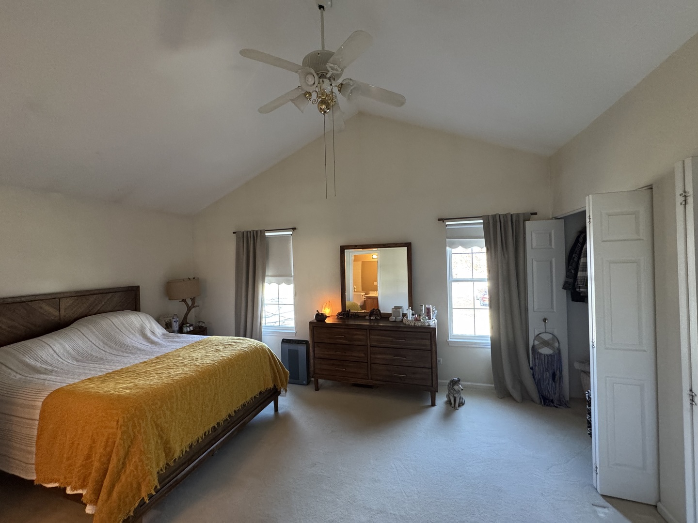 1124 Blackburn Drive Grayslake, IL 60030 - Photo 6 of 19 a bedroom with a bed and a chandelier