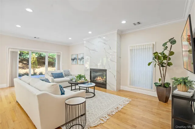 a large kitchen with a large counter top appliances and wooden floor