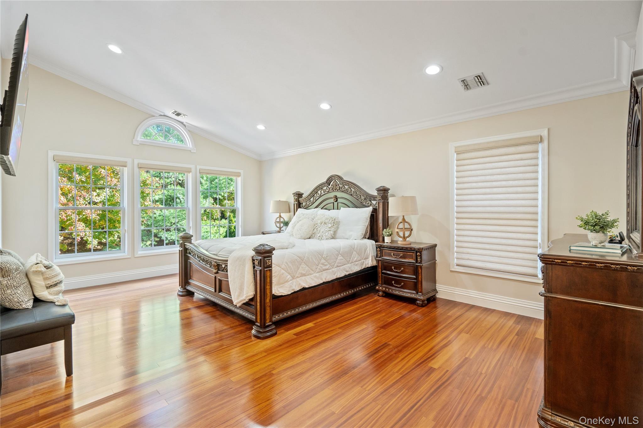 176 Sagamore Drive Plainview, NY 11803 - Photo 14 of 40 a spacious bedroom with a large bed and a large window