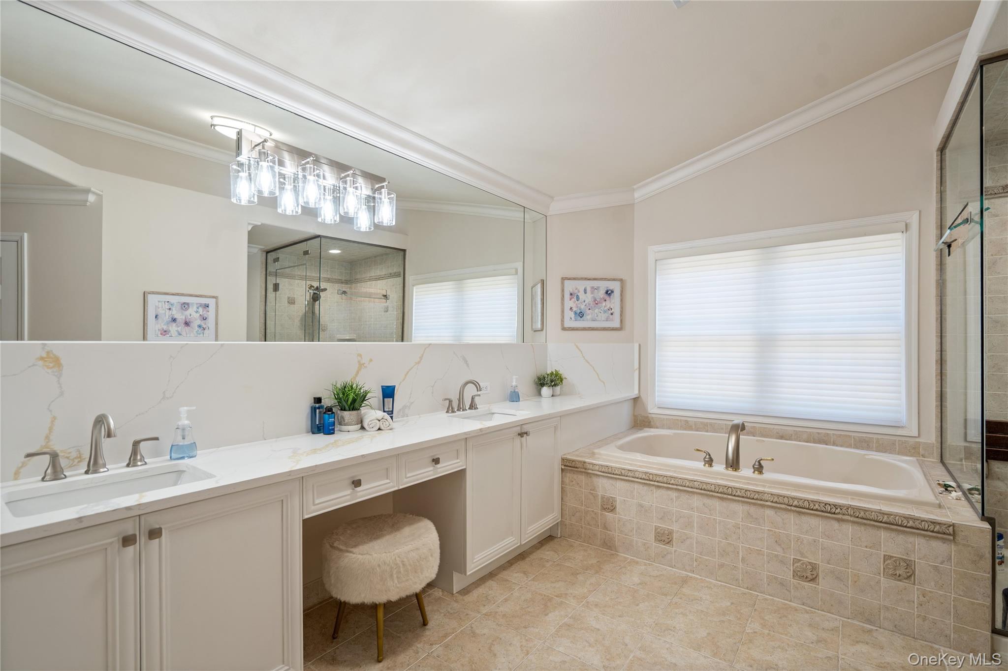 176 Sagamore Drive Plainview, NY 11803 - Photo 15 of 40 a bathroom with a sink double vanity and a tub