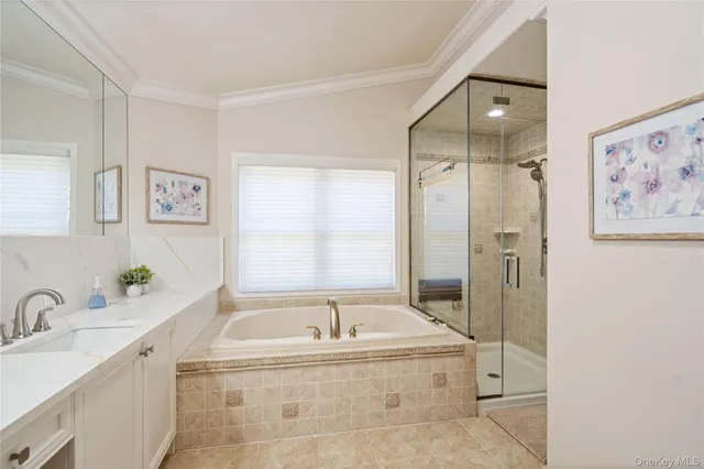 a spacious bedroom with a large bed and a large window