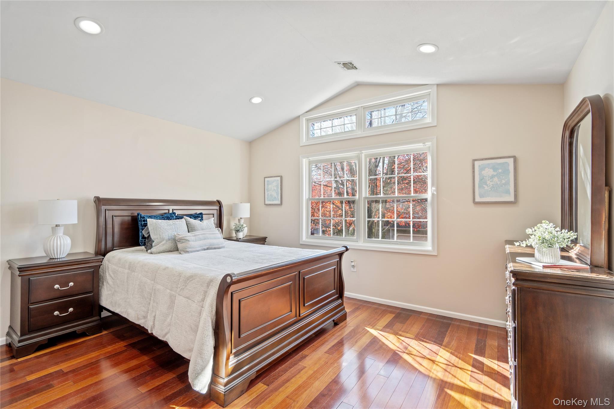 176 Sagamore Drive Plainview, NY 11803 - Photo 17 of 40 a bedroom with a bed and wooden floor