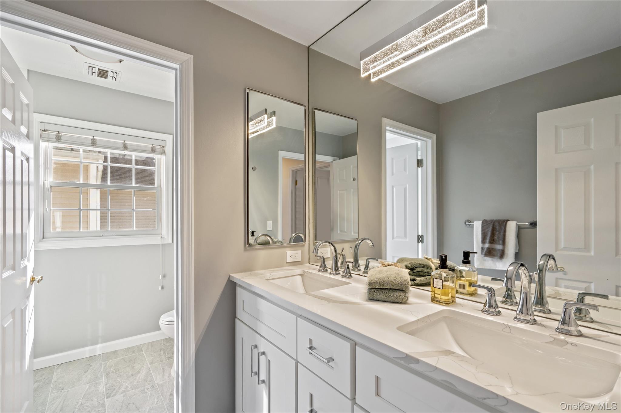 176 Sagamore Drive Plainview, NY 11803 - Photo 18 of 40 a bathroom with a double vanity sink mirror and double