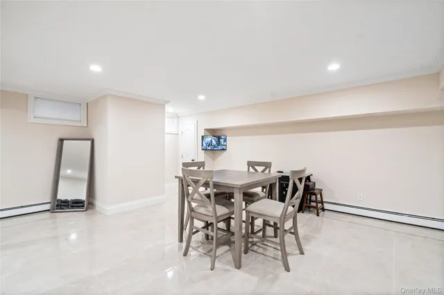 a living room with couches and a flat screen tv