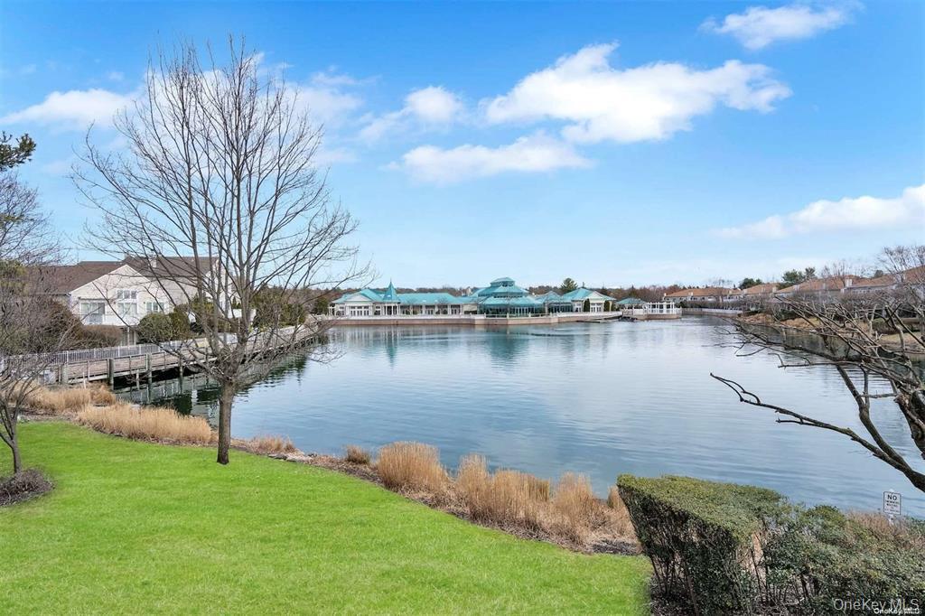 176 Sagamore Drive Plainview, NY 11803 - Photo 30 of 40 a view of a lake with houses in the back
