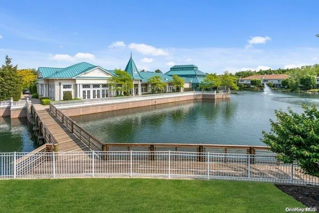 a view of a dining room with a table and chairs