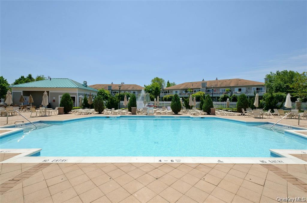 176 Sagamore Drive Plainview, NY 11803 - Photo 35 of 40 a view of a swimming pool in front of house