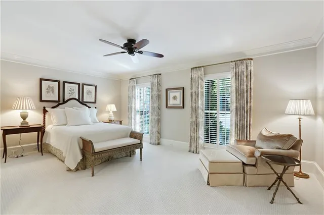 a spacious bedroom with a bed and a couch