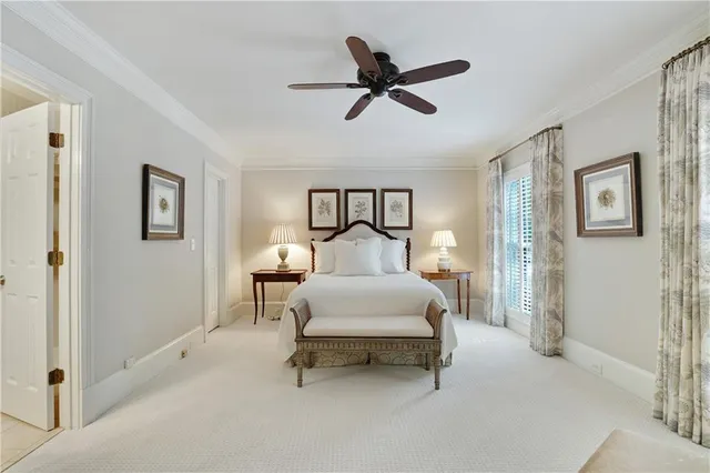 a bed room with a bed and a chandelier