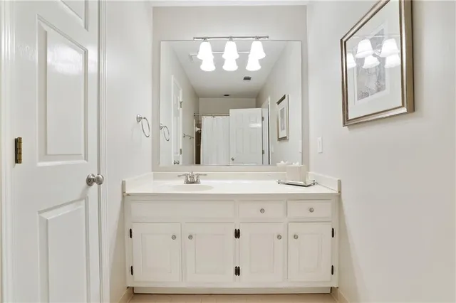 a bathroom with a double vanity sink and mirror