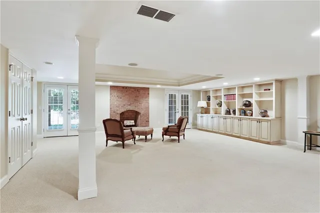 a living room with furniture and a dining table with projector