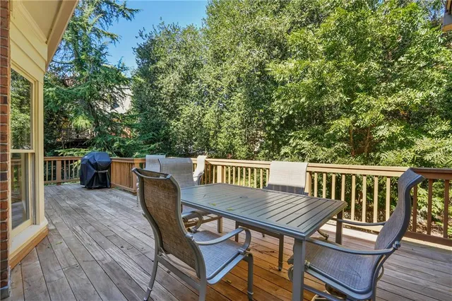 a view of a chairs and table on the deck