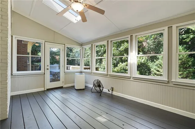 a view of a room with wooden floor and balcony