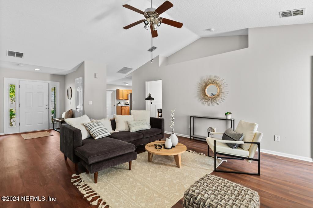 96014 Morton Lane Yulee, FL 32097 - Photo 12 of 45 a living room with furniture and a wooden floor