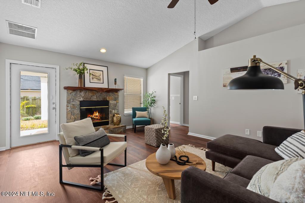 96014 Morton Lane Yulee, FL 32097 - Photo 14 of 45 a living room with furniture and a fireplace