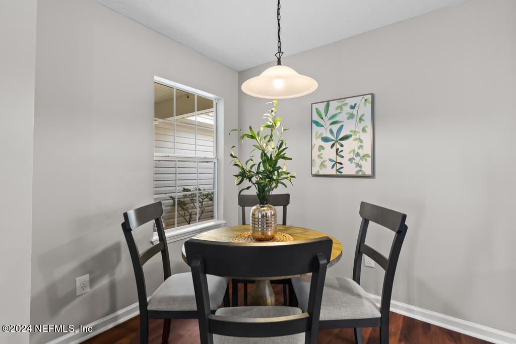96014 Morton Lane Yulee, FL 32097 - Photo 15 of 45 a view of a dining room with a table and chairs