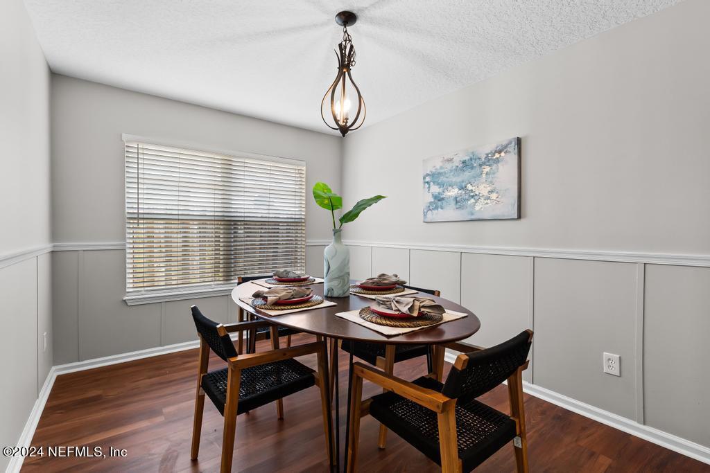 96014 Morton Lane Yulee, FL 32097 - Photo 21 of 45 a dining room with furniture a rug and wooden floor