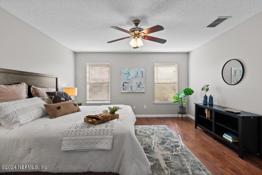 96014 Morton Lane Yulee, FL 32097 - Photo 27 of 45 a bedroom with a bed furniture and a window