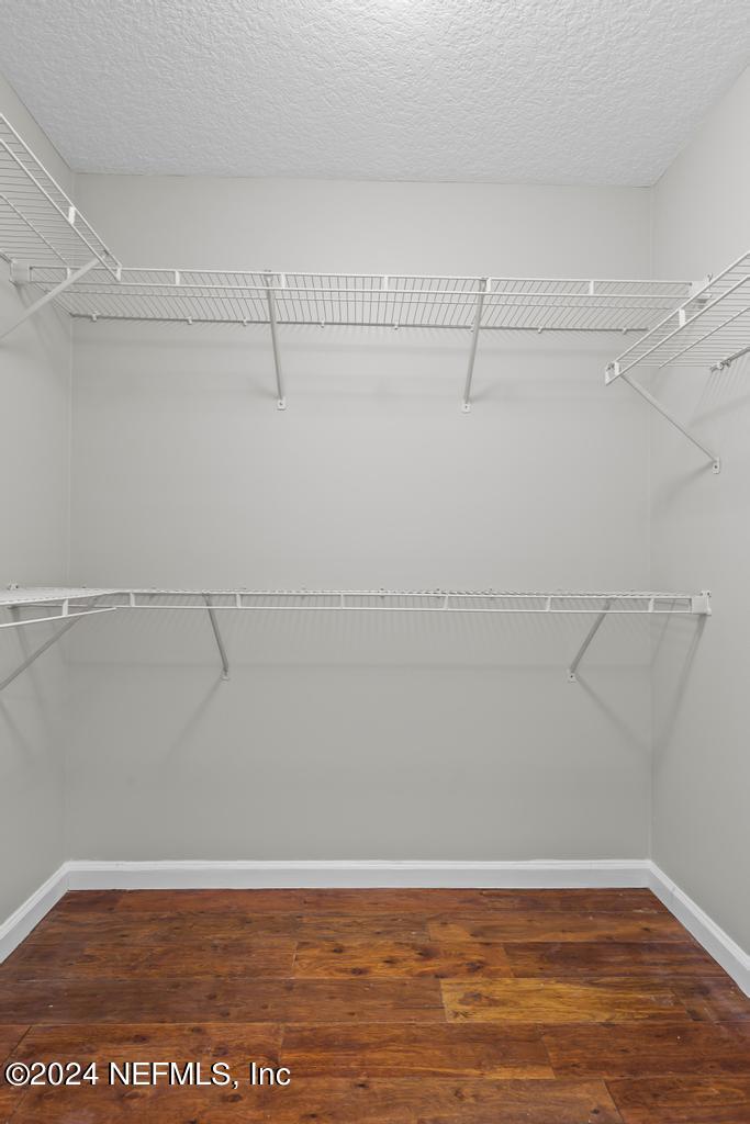 96014 Morton Lane Yulee, FL 32097 - Photo 29 of 45 a view of a room with racks on the wall