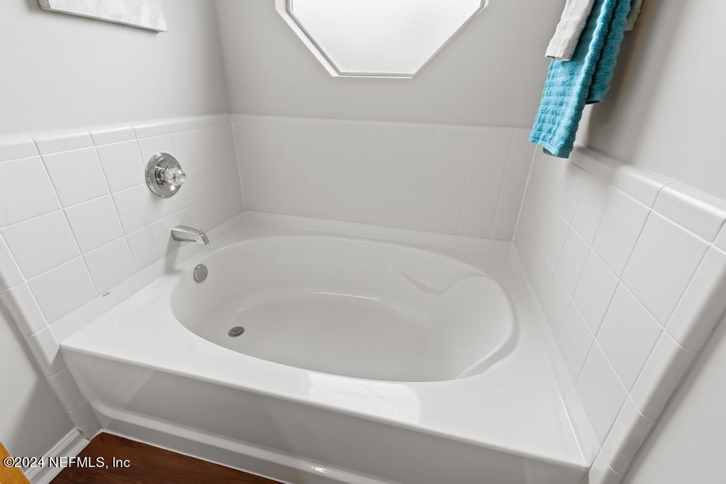 96014 Morton Lane Yulee, FL 32097 - Photo 32 of 45 a white bath tub sitting in a bathroom