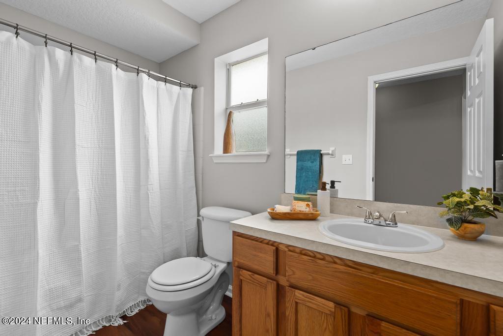 96014 Morton Lane Yulee, FL 32097 - Photo 36 of 45 a bathroom with a sink and a mirror