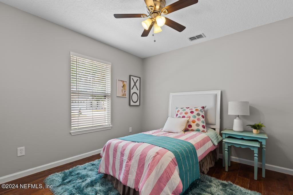 96014 Morton Lane Yulee, FL 32097 - Photo 38 of 45 a bedroom with a bed and a window